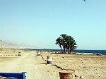 On the way to the south, viewing backward from the jeep. In the far you can see some hotels of Dahab.